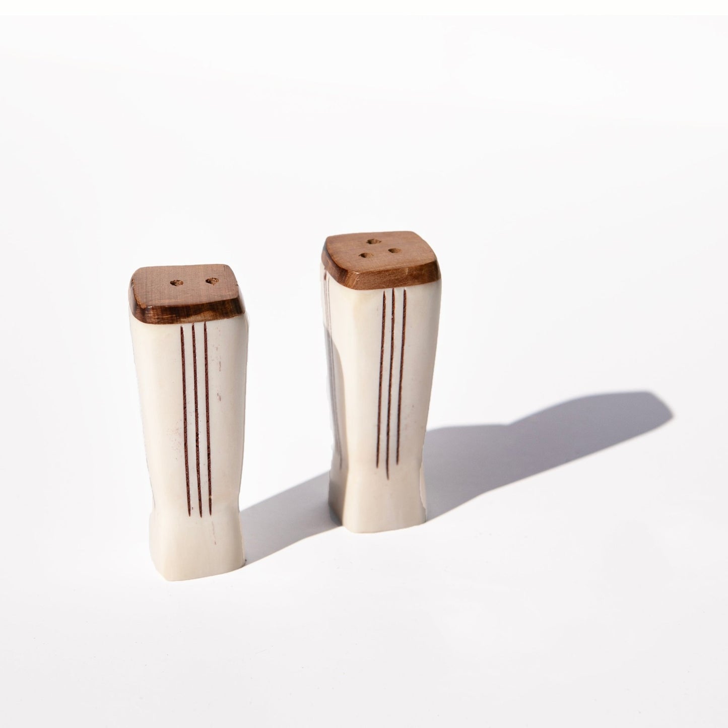 Handcarved cowbone salt and pepper shakers from Uganda, artisan made, rustic and unique.