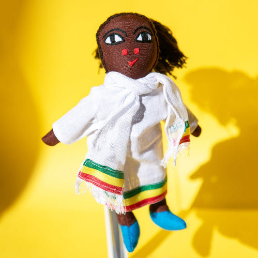Handmade Ethiopian doll with red, green, yellow, white clothing