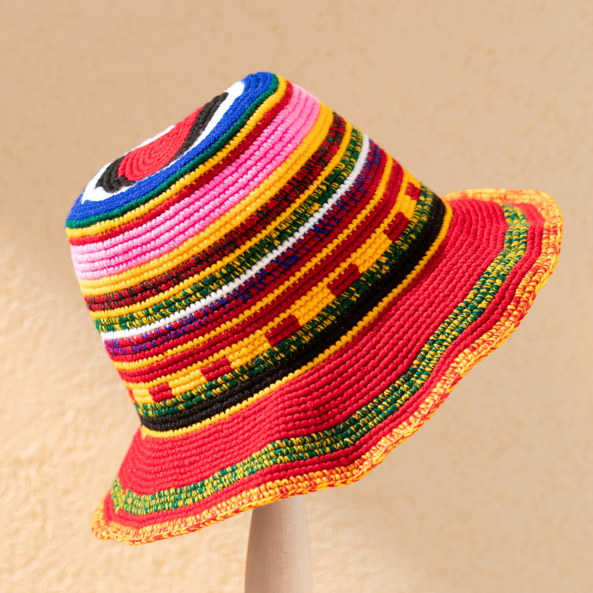 Red Konso crochet wide brim hat handmade in Ethiopia with colorful striped and geometric details in pink, yellow, green, blue and black