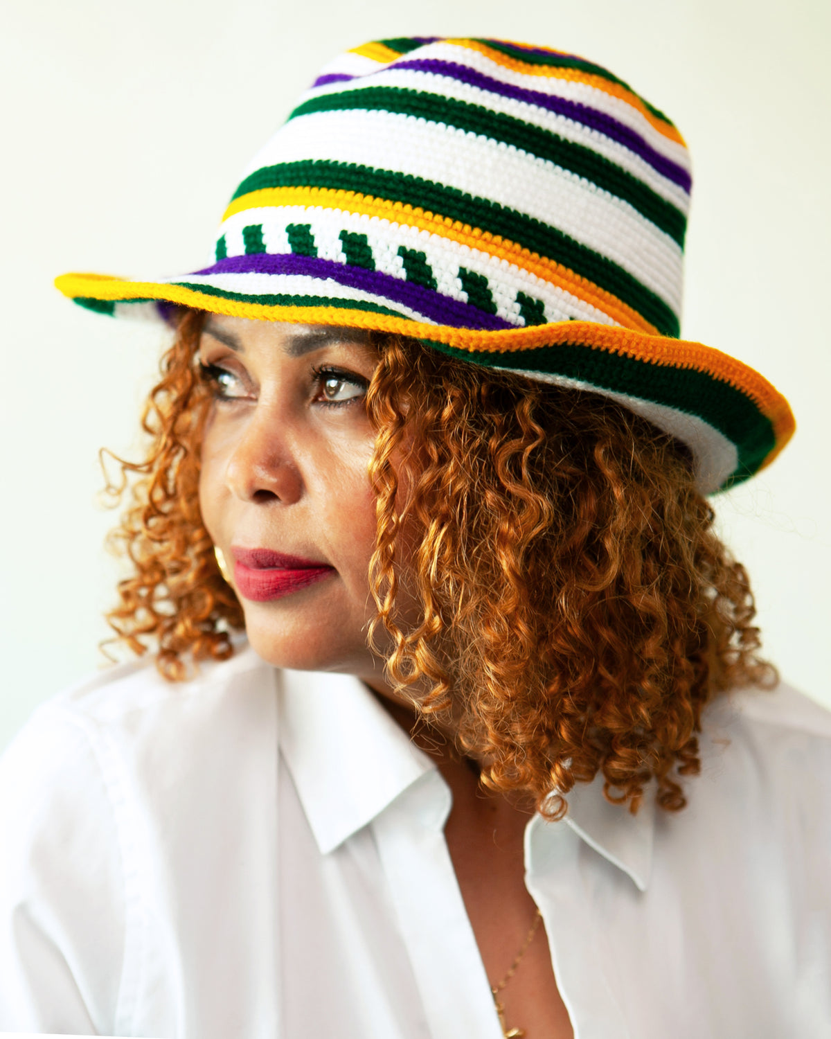 Hand-crocheted Ethiopian fedora hat in green, purple, yellow, orange and white stripes, handmade in Konso, Ethiopia.